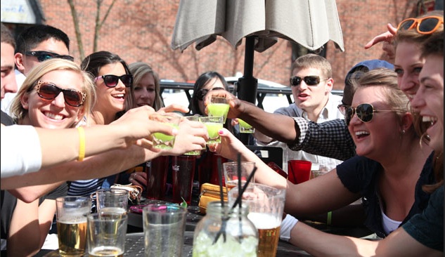 College football fans enjoying drinks at Good Time Charley's, a Rockbot venue in Ann Arbor, MI.