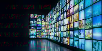 Image of hundreds of multi-color screens showing different images, meant to represent the state of retail media in 2026