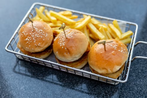 mini-burgers-with-french-fries-served-at-the-bar-2023-11-27-05-25-15-utc